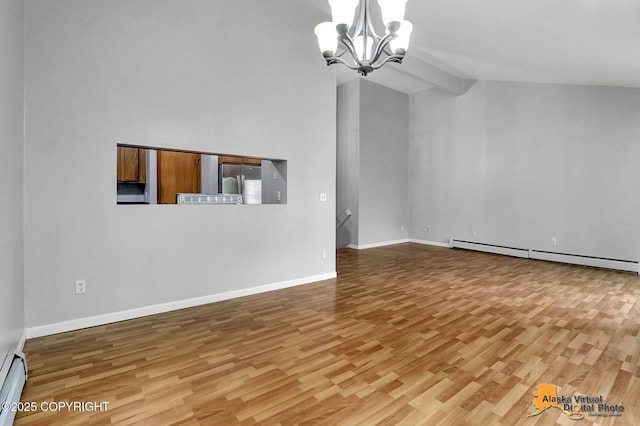 18739 Sarichef Loop, Eagle River, AK 99577 - unfurnished living room with wood finished floors, lofted ceiling, a chandelier, a baseboard radiator, and baseboard heating