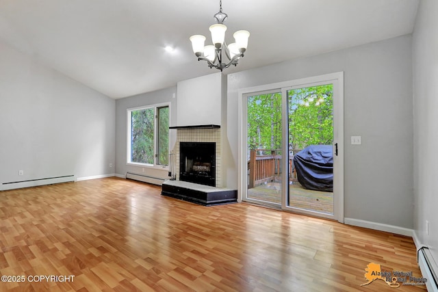 18739 Sarichef Loop, Eagle River, AK 99577 - unfurnished living room with baseboard heating, light wood-style flooring, a chandelier, and lofted ceiling