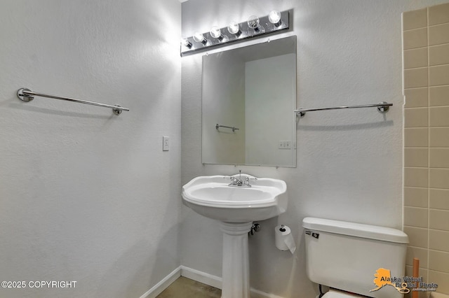 18739 Sarichef Loop, Eagle River, AK 99577 - bathroom featuring toilet and baseboards