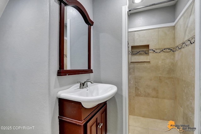 18739 Sarichef Loop, Eagle River, AK 99577 - full bath with vanity, tiled shower, and a textured wall