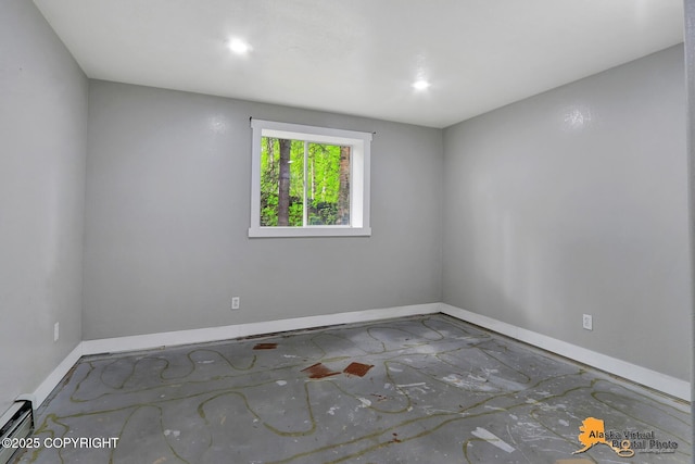 18739 Sarichef Loop, Eagle River, AK 99577 - spare room featuring baseboards, a baseboard radiator, and recessed lighting