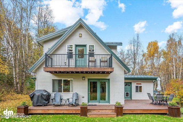 20838 Helluva St, Chugiak, AK 99567 - back of house featuring a balcony, a yard, a wooden deck, and outdoor dining area