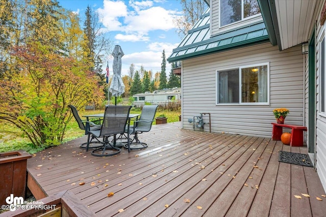 20838 Helluva St, Chugiak, AK 99567 - wooden deck featuring outdoor dining space