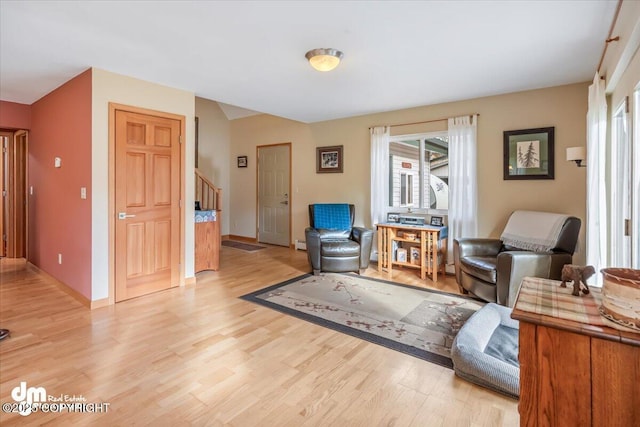 20838 Helluva St, Chugiak, AK 99567 - living area with stairway, light wood-style floors, and baseboards