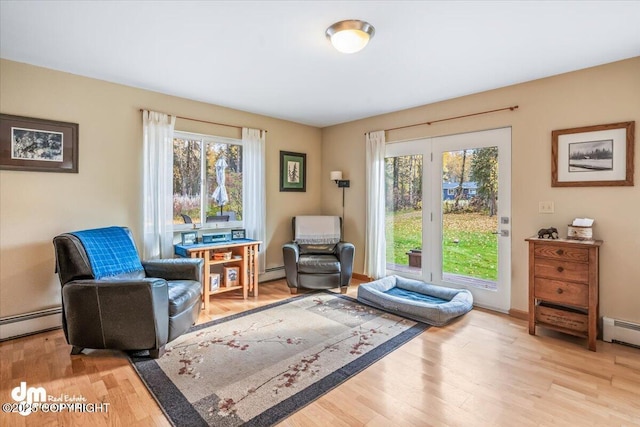 20838 Helluva St, Chugiak, AK 99567 - sitting room featuring plenty of natural light, wood finished floors, and baseboard heating