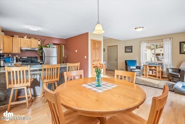 20838 Helluva St, Chugiak, AK 99567 - dining area with light wood-style floors