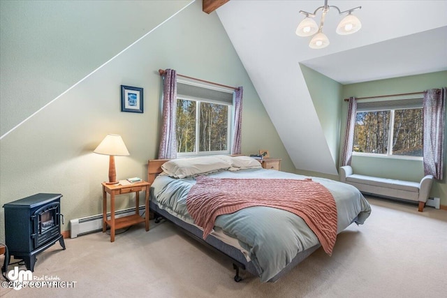 20838 Helluva St, Chugiak, AK 99567 - carpeted bedroom with vaulted ceiling, baseboard heating, a wood stove, and a chandelier