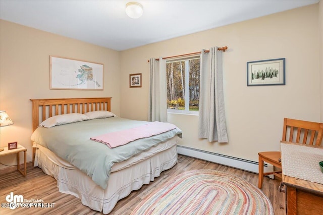 20838 Helluva St, Chugiak, AK 99567 - bedroom with a baseboard radiator and light wood-style floors