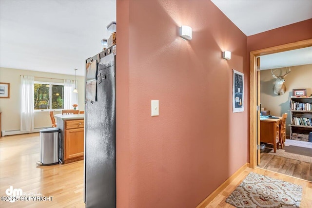 20838 Helluva St, Chugiak, AK 99567 - hallway with light wood-style floors and baseboards