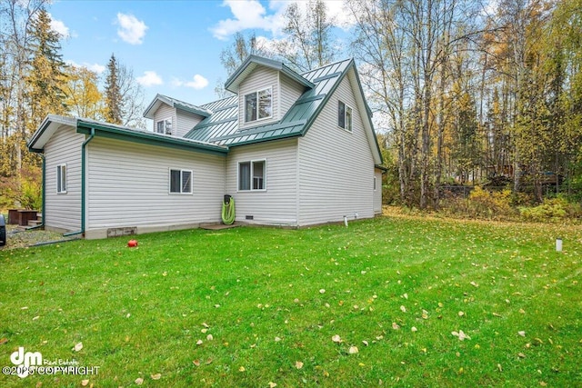 20838 Helluva St, Chugiak, AK 99567 - view of home's exterior featuring a lawn and metal roof