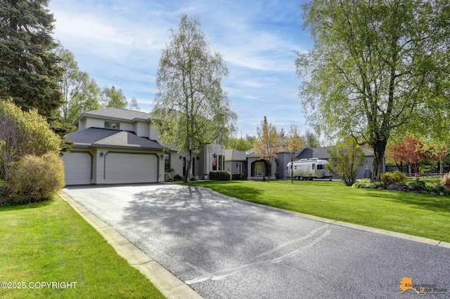 740 Botanical Heights Cir, Anchorage, AK 99515 - view of front of house featuring a garage, driveway, a front lawn, and a residential view