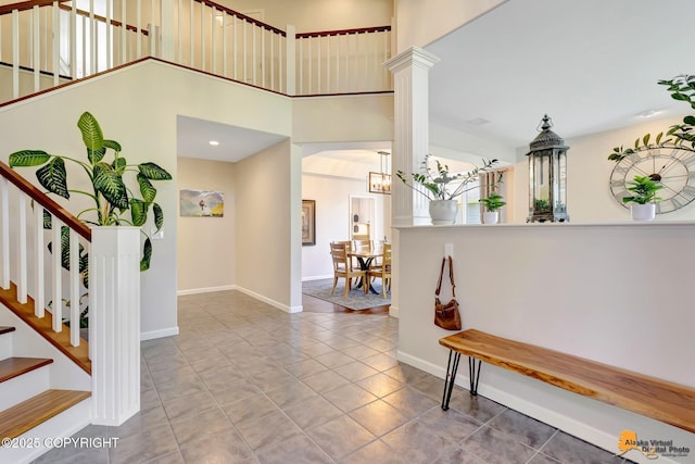 740 Botanical Heights Cir, Anchorage, AK 99515 - tiled entryway with stairs, baseboards, and a high ceiling
