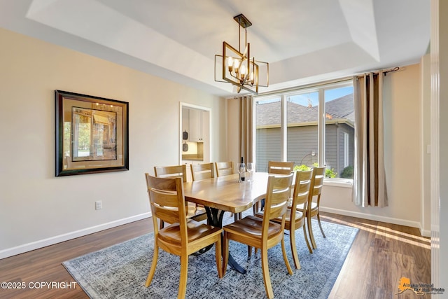 740 Botanical Heights Cir, Anchorage, AK 99515 - dining room with a chandelier, baseboards, a tray ceiling, and dark wood-style floors