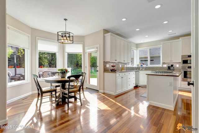 740 Botanical Heights Cir, Anchorage, AK 99515 - kitchen featuring appliances with stainless steel finishes, healthy amount of natural light, light wood-style flooring, and recessed lighting