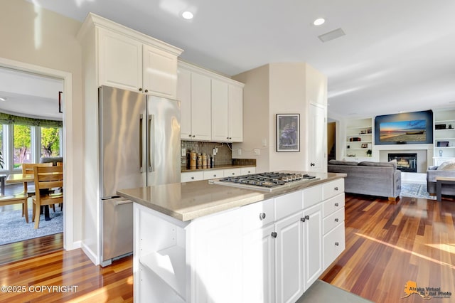 740 Botanical Heights Cir, Anchorage, AK 99515 - kitchen with appliances with stainless steel finishes, dark wood-style flooring, white cabinetry, a center island, and recessed lighting