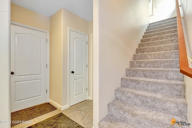 740 Botanical Heights Cir, Anchorage, AK 99515 - stairway featuring tile patterned floors and baseboards