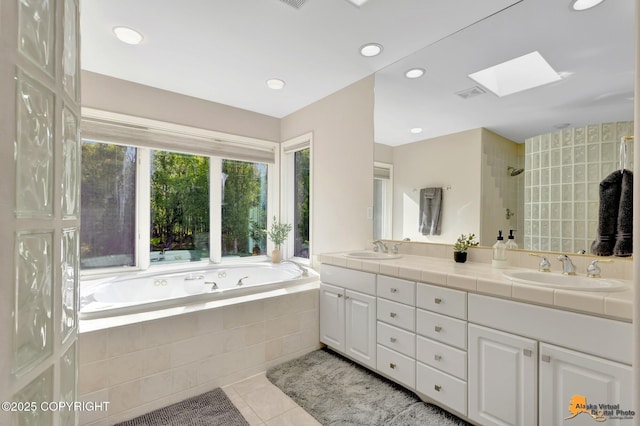 740 Botanical Heights Cir, Anchorage, AK 99515 - full bath with a skylight, double vanity, a garden tub, tile patterned flooring, and a tile shower