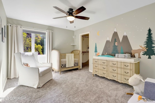 740 Botanical Heights Cir, Anchorage, AK 99515 - bedroom with a spacious closet, light carpet, a ceiling fan, and a closet