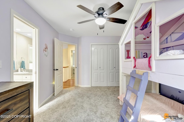 740 Botanical Heights Cir, Anchorage, AK 99515 - bedroom featuring carpet flooring, a closet, baseboards, and a ceiling fan