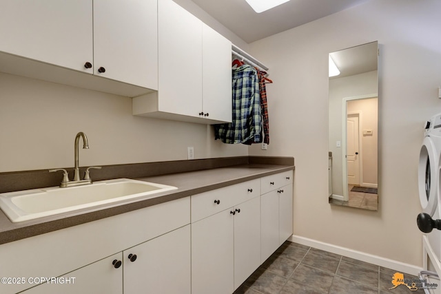 740 Botanical Heights Cir, Anchorage, AK 99515 - laundry area with cabinet space and baseboards