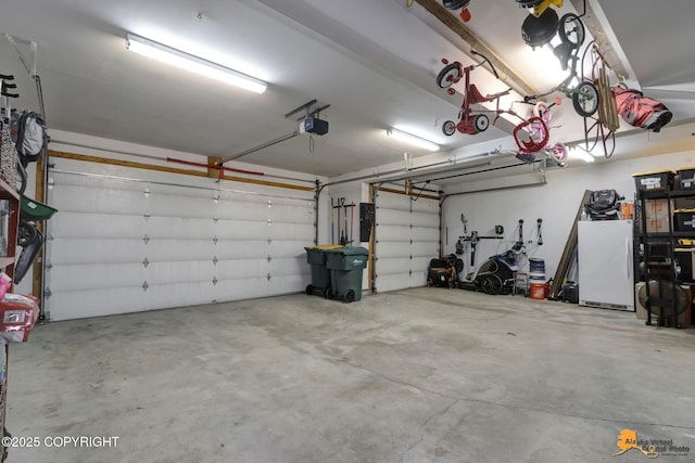 740 Botanical Heights Cir, Anchorage, AK 99515 - garage with freestanding refrigerator and a garage door opener