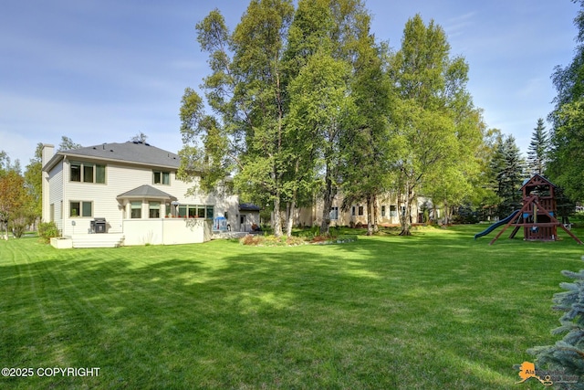 740 Botanical Heights Cir, Anchorage, AK 99515 - view of grassy yard with a playground