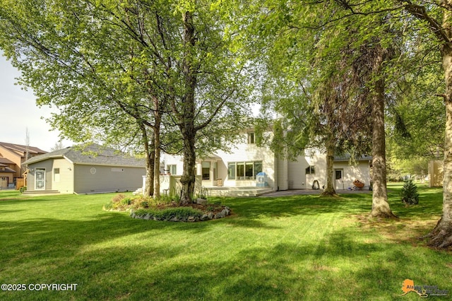 740 Botanical Heights Cir, Anchorage, AK 99515 - view of green lawn featuring a patio area