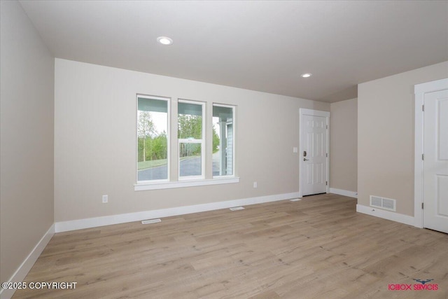 9089 E Spring Creek Cir, Palmer, AK 99645 - empty room with baseboards, light wood finished floors, and recessed lighting