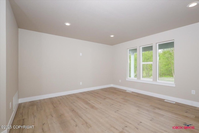 9089 E Spring Creek Cir, Palmer, AK 99645 - empty room featuring light wood-type flooring, baseboards, and recessed lighting