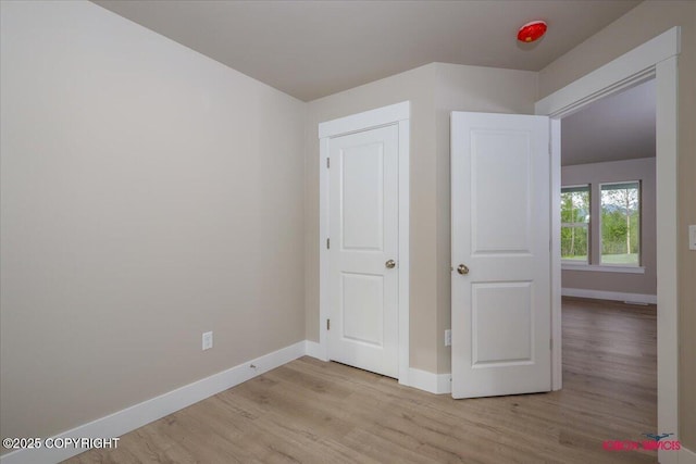 9089 E Spring Creek Cir, Palmer, AK 99645 - unfurnished bedroom with light wood finished floors and baseboards