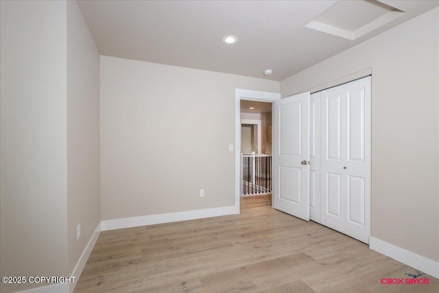 9089 E Spring Creek Cir, Palmer, AK 99645 - unfurnished bedroom with recessed lighting, baseboards, light wood-style floors, and a closet