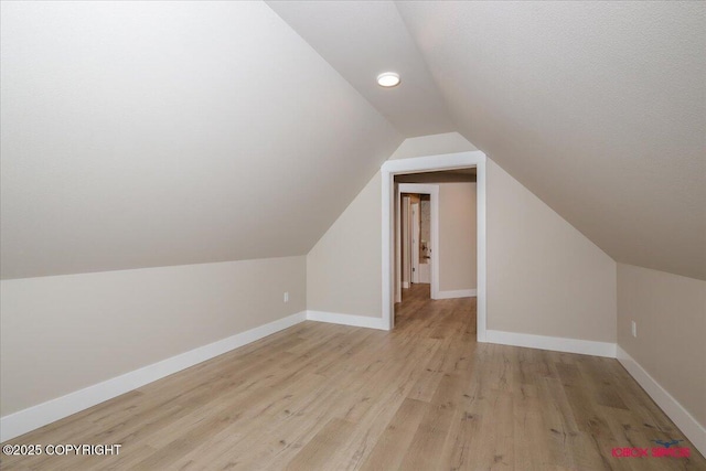9089 E Spring Creek Cir, Palmer, AK 99645 - bonus room featuring lofted ceiling, light wood-style floors, and baseboards