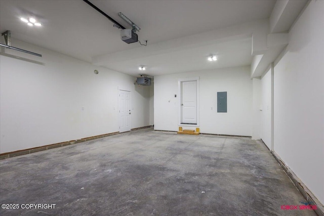9089 E Spring Creek Cir, Palmer, AK 99645 - garage featuring a garage door opener and electric panel