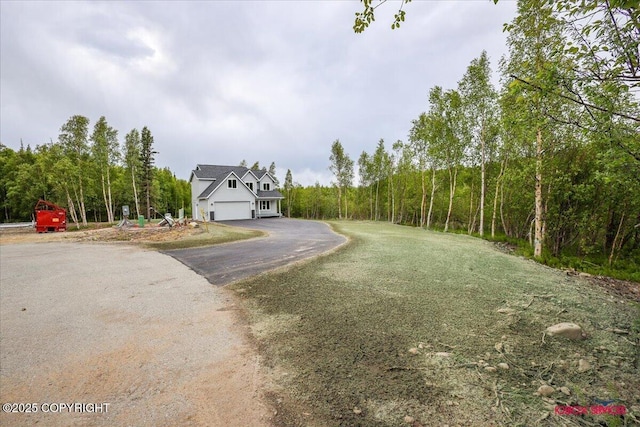 9089 E Spring Creek Cir, Palmer, AK 99645 - view of front facade with asphalt driveway and a garage