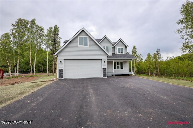 9089 E Spring Creek Cir, Palmer, AK 99645 - traditional-style house featuring driveway and a garage
