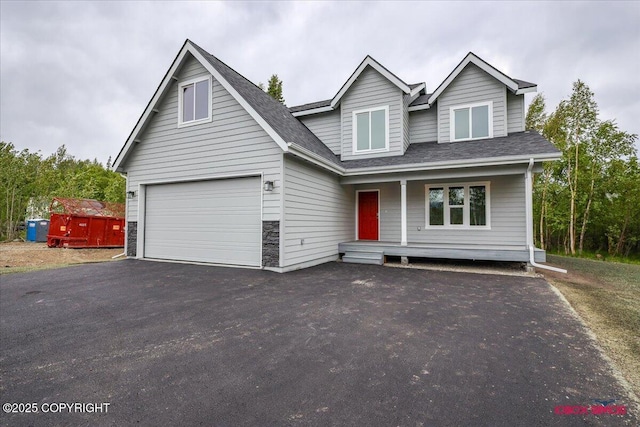 9089 E Spring Creek Cir, Palmer, AK 99645 - traditional-style home with a porch, driveway, and roof with shingles