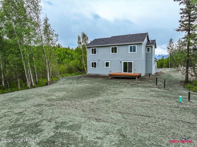 9089 E Spring Creek Cir, Palmer, AK 99645 - rear view of house with a wooden deck