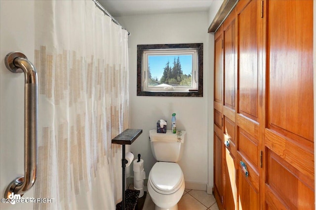 5301 N Glacier View Ct, Homer, AK 99603 - full bathroom with tile patterned floors, toilet, and a shower with curtain