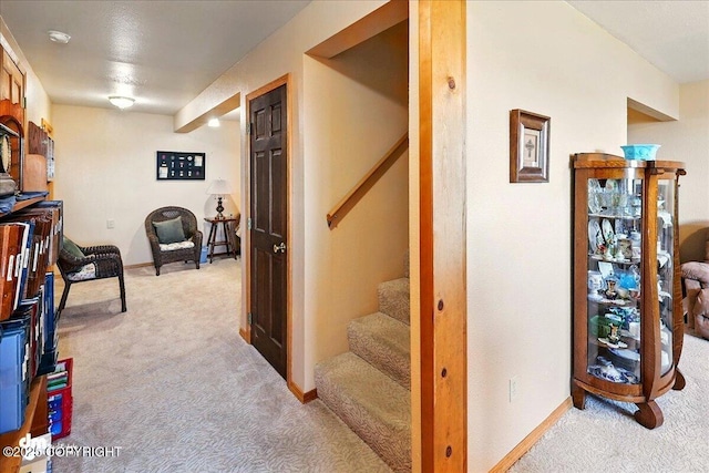 5301 N Glacier View Ct, Homer, AK 99603 - hallway with light carpet, stairs, and baseboards