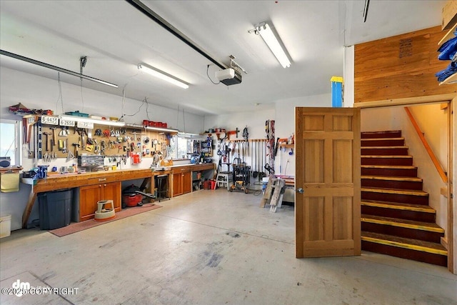5301 N Glacier View Ct, Homer, AK 99603 - garage with a workshop area and a garage door opener