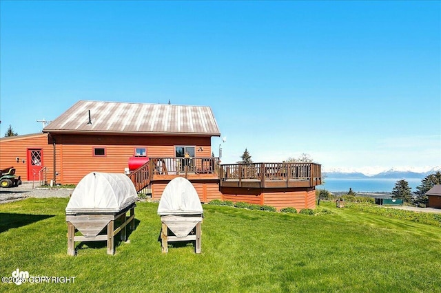 5301 N Glacier View Ct, Homer, AK 99603 - back of house with a deck with water view, a yard, and metal roof