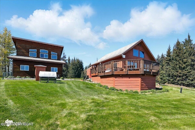 5301 N Glacier View Ct, Homer, AK 99603 - rear view of property featuring a yard, a deck, and metal roof