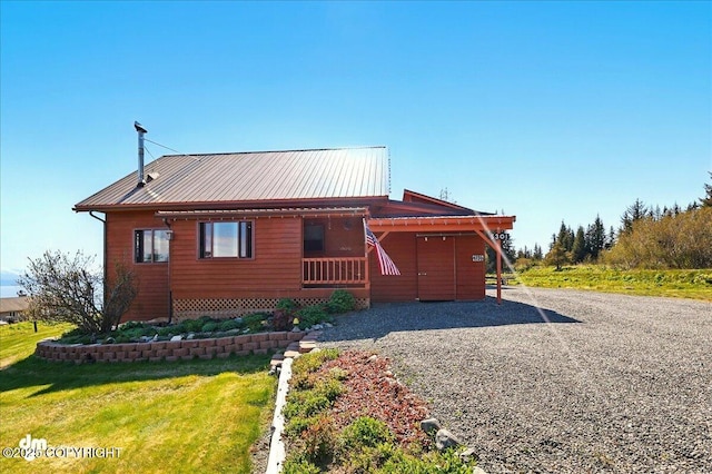 5301 N Glacier View Ct, Homer, AK 99603 - rustic home featuring a front lawn and metal roof