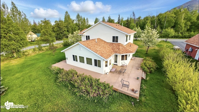 17110 E Kathy Cir, Palmer, AK 99645 - rear view of property featuring a wooden deck, a lawn, and a shingled roof