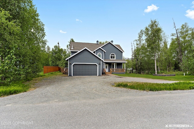 1675 E Pintail Dr, Wasilla, AK 99645 - view of front of house with covered porch, a garage, dirt driveway, and a shingled roof