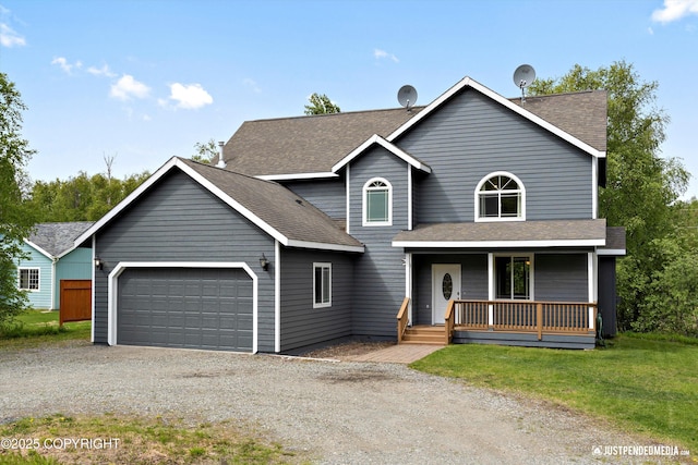 1675 E Pintail Dr, Wasilla, AK 99645 - view of front of property with a porch, an attached garage, driveway, and a shingled roof