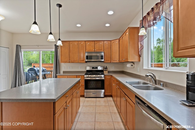 1675 E Pintail Dr, Wasilla, AK 99645 - kitchen with stainless steel appliances, a sink, light tile patterned flooring, recessed lighting, and pendant lighting