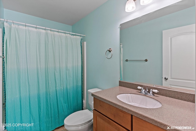 1675 E Pintail Dr, Wasilla, AK 99645 - full bathroom featuring vanity, toilet, and a shower with shower curtain