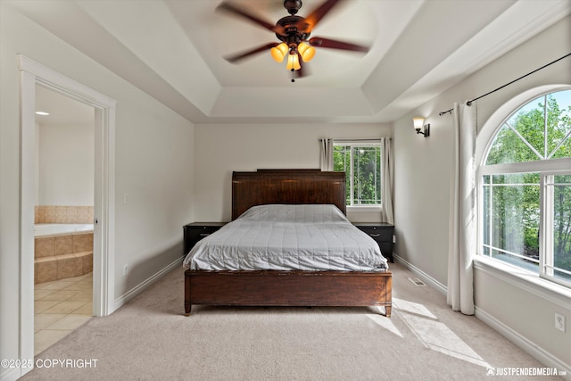 1675 E Pintail Dr, Wasilla, AK 99645 - bedroom with multiple windows, light carpet, and a tray ceiling