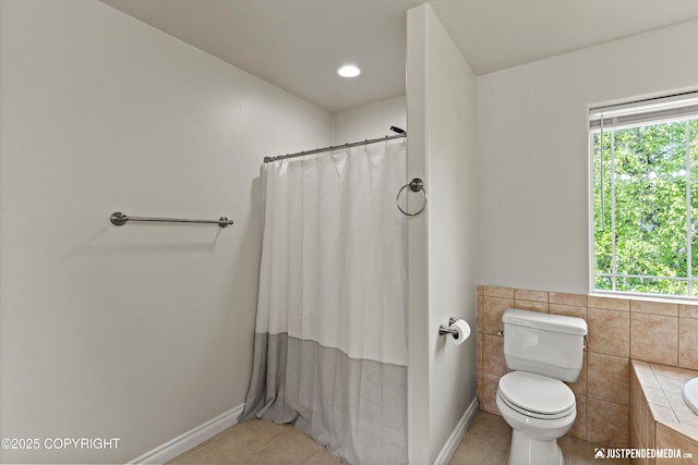 1675 E Pintail Dr, Wasilla, AK 99645 - full bath featuring tile patterned floors, healthy amount of natural light, toilet, and curtained shower